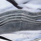 Inside view of gray camo mini bag with stitched lining and black trim