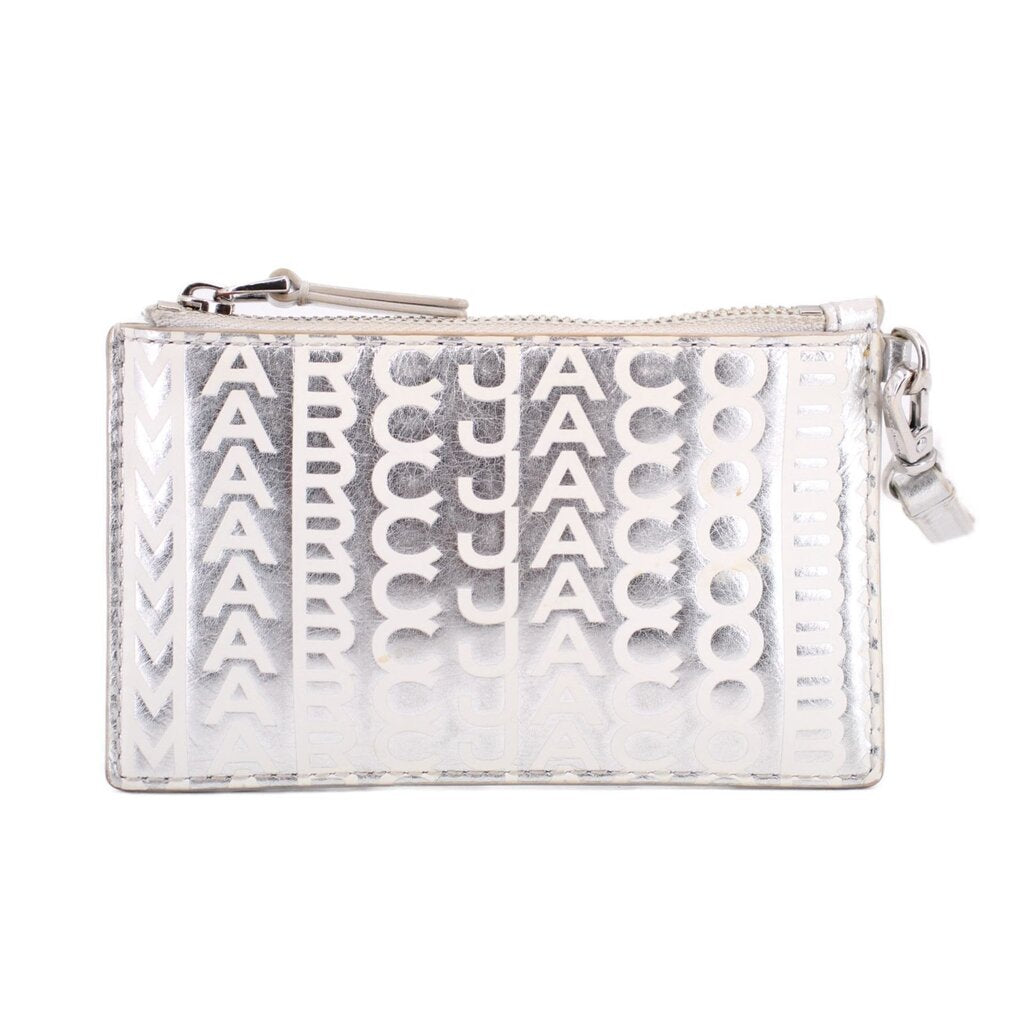 Silver monogram top-zip wristlet wallet with side hardware and wrist strap