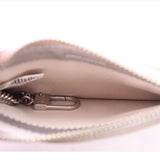 Wristlet wallet interior with beige lining and top zip slider