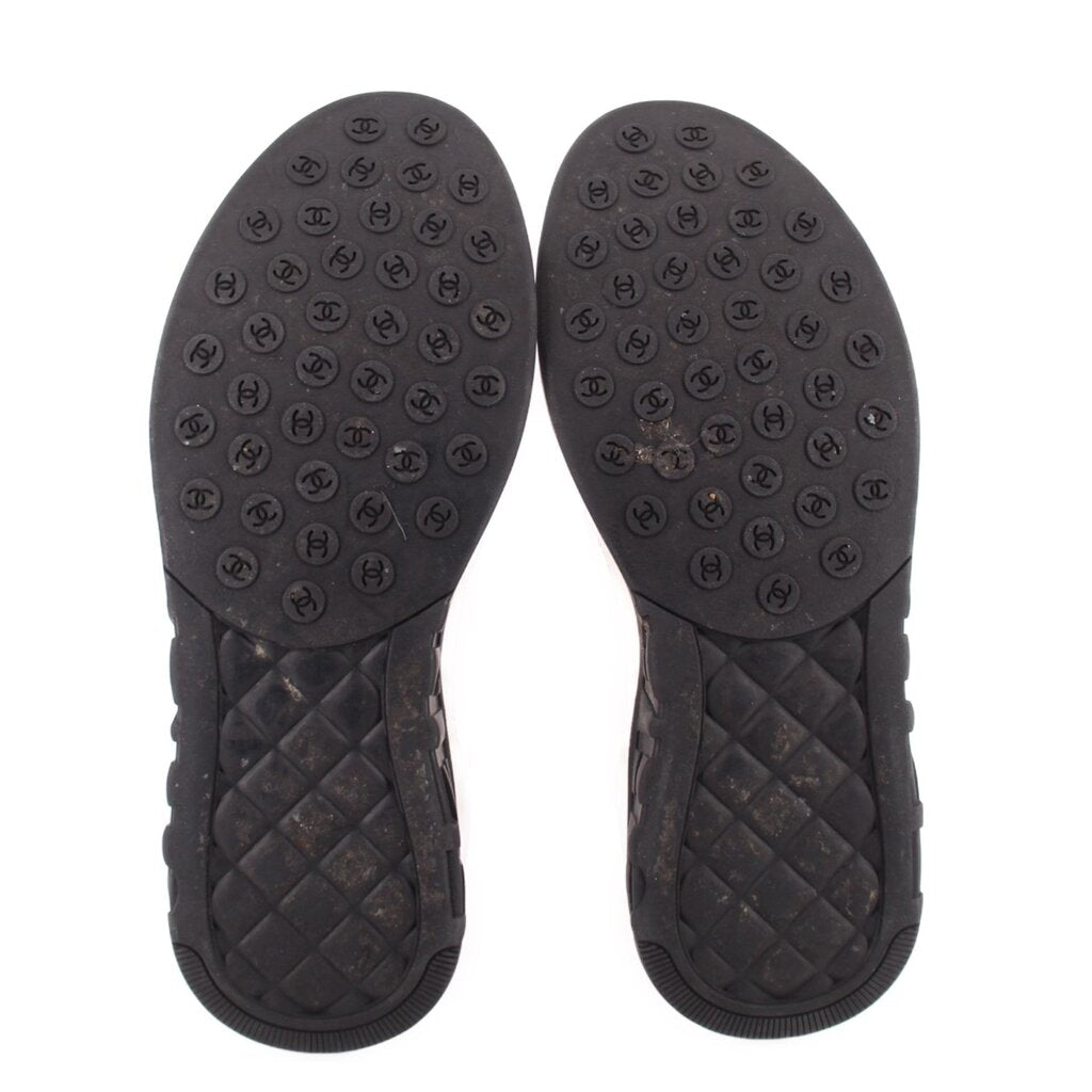 CHANEL mesh sneakers outsoles, black tread with repeated CHANEL logo pattern