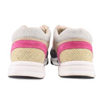 CHANEL multi-color sneakers with fabric heel, pink trim, and white rubber sole