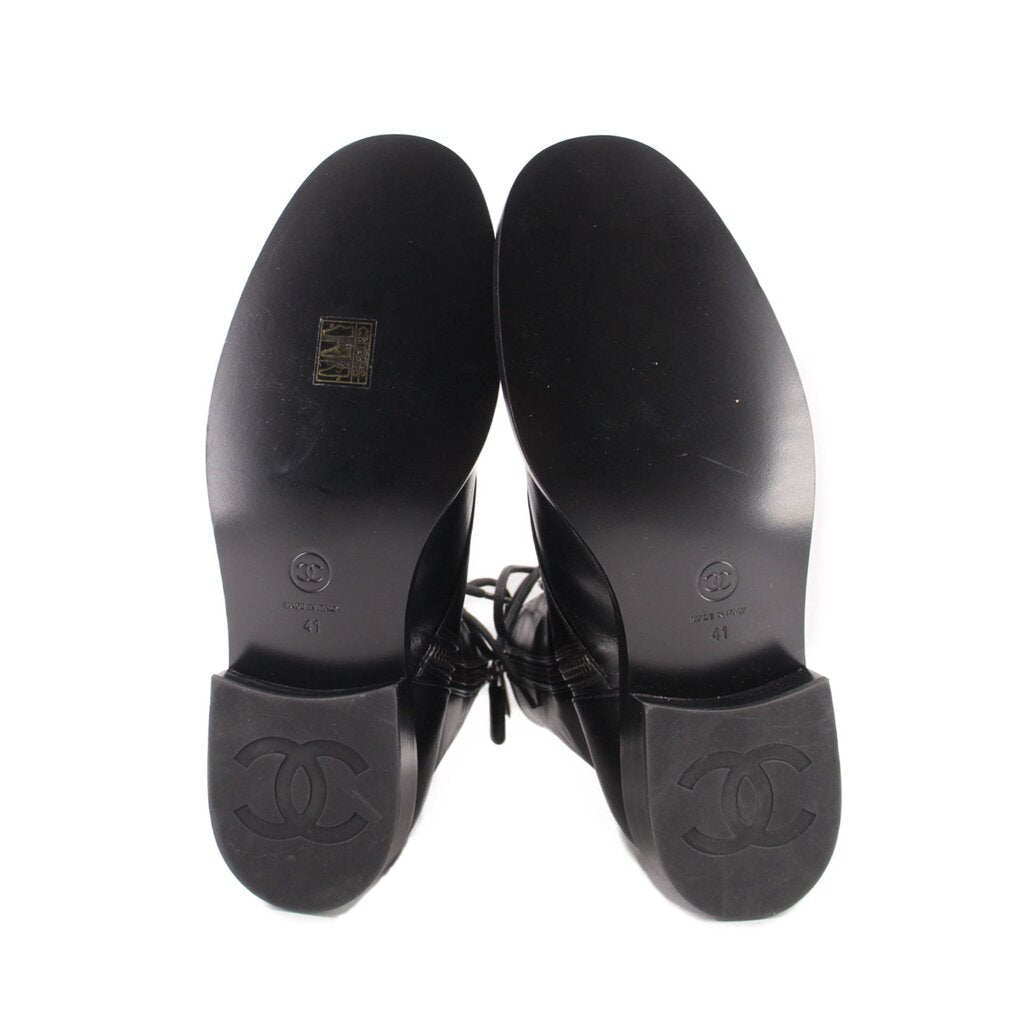 CHANEL black combat boots outsoles, treaded rubber soles with logo stamps