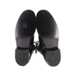 CHANEL black combat boots outsoles, treaded rubber soles with logo stamps