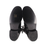 CHANEL black combat boots outsoles, treaded rubber soles with logo stamps