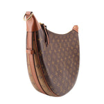 Monogram hobo crossbody bag with tan leather strap, gold chain, and zipper top