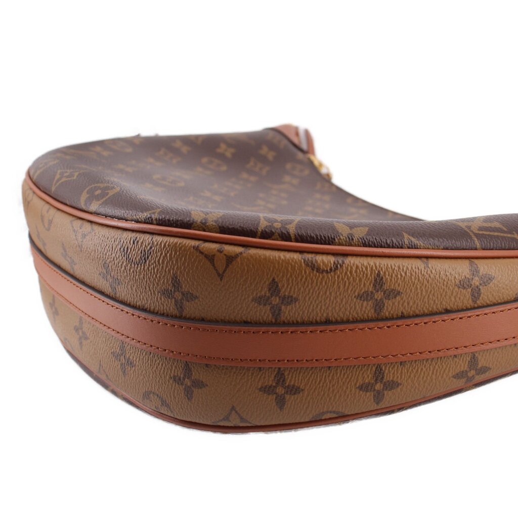 Monogram hobo crossbody bag corner with tan leather edge trim