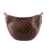 Monogram hobo crossbody bag with curved silhouette and tan leather top trim