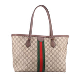 Large tote bag with brown handles, beige GG canvas, and centered green-red web stripe