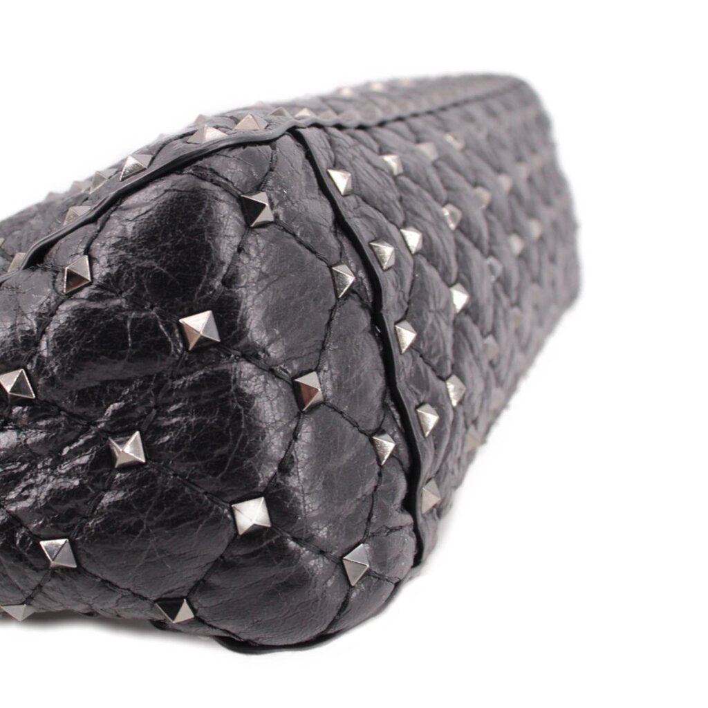 Black quilted leather bag with silver-tone Rockstud details along the edge