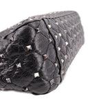 Black quilted leather bag with silver-tone Rockstud details along the edge