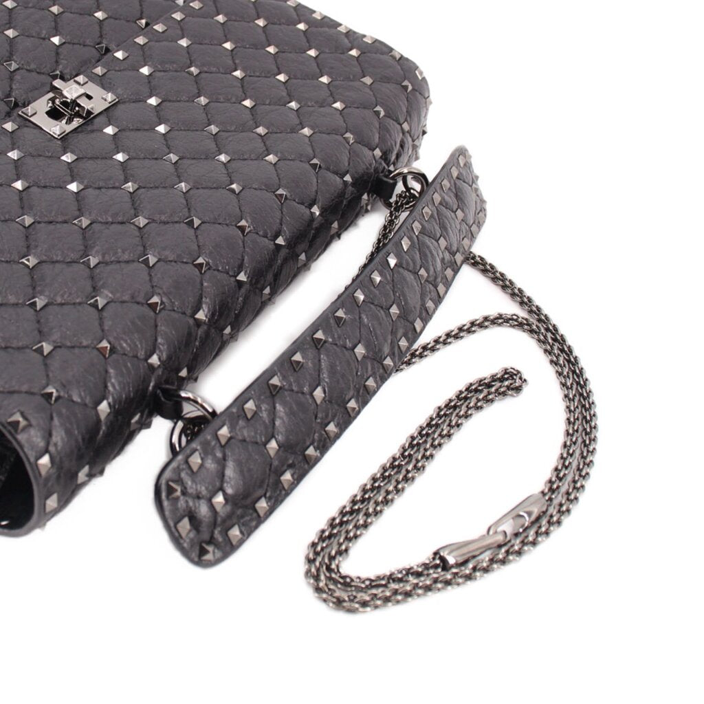 Black quilted bag with silver-tone Rockstud trim and braided chain shoulder strap