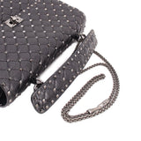 Black quilted bag with silver-tone Rockstud trim and braided chain shoulder strap