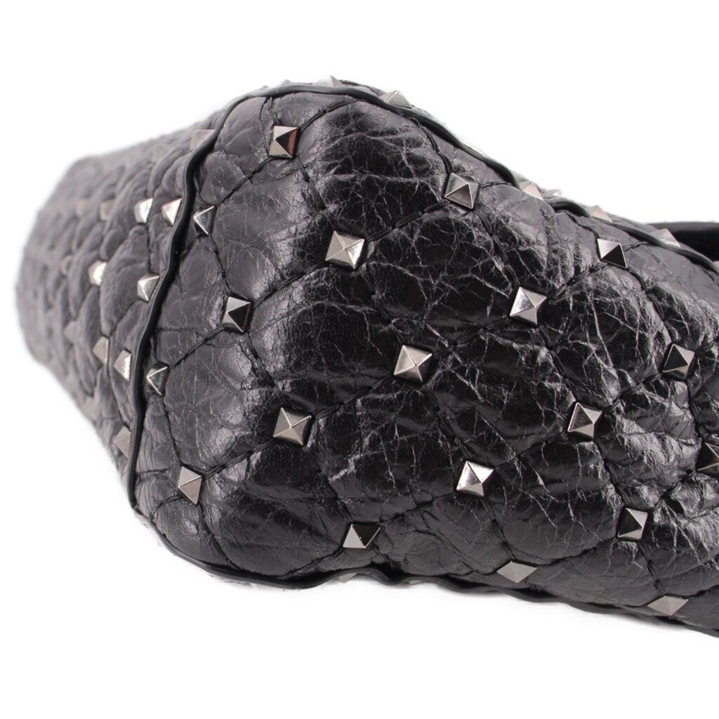 Black quilted leather bag with silver-tone Rockstud pyramid studs and braided trim