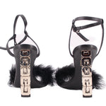 Black sandals with ankle straps and shiny cube block heels, feather trim