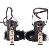 Black sandals with ankle straps and shiny cube block heels, feather trim