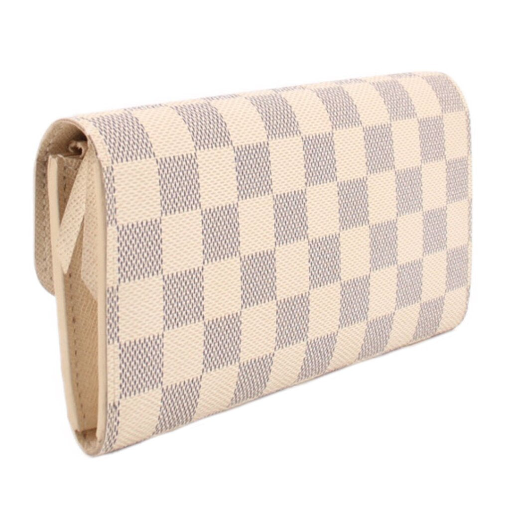 Damier Azur checkered wallet viewed from side, showing flap and stitching