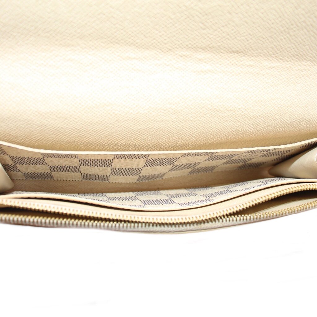 Damier Azur wallet interior with gold-tone zipper track and checkered lining