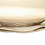 Damier Azur wallet interior with gold-tone zipper track and checkered lining
