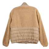 Tan sherpa jacket with quilted lower back panel, zip front, ribbed hem