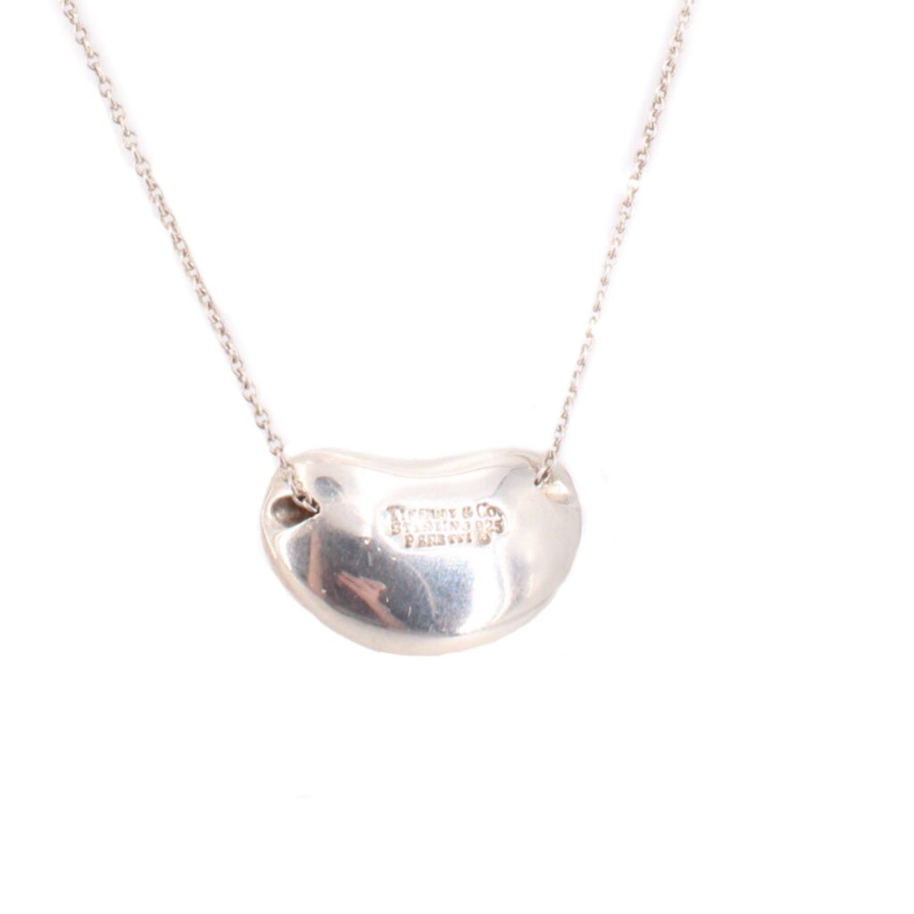 Sterling silver bean pendant necklace with polished surface and engraved detail