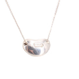 Sterling silver bean pendant necklace with polished surface and engraved detail