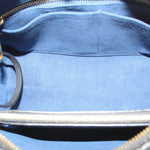 Interior view of black zip compartment with fabric lining and gold zipper teeth