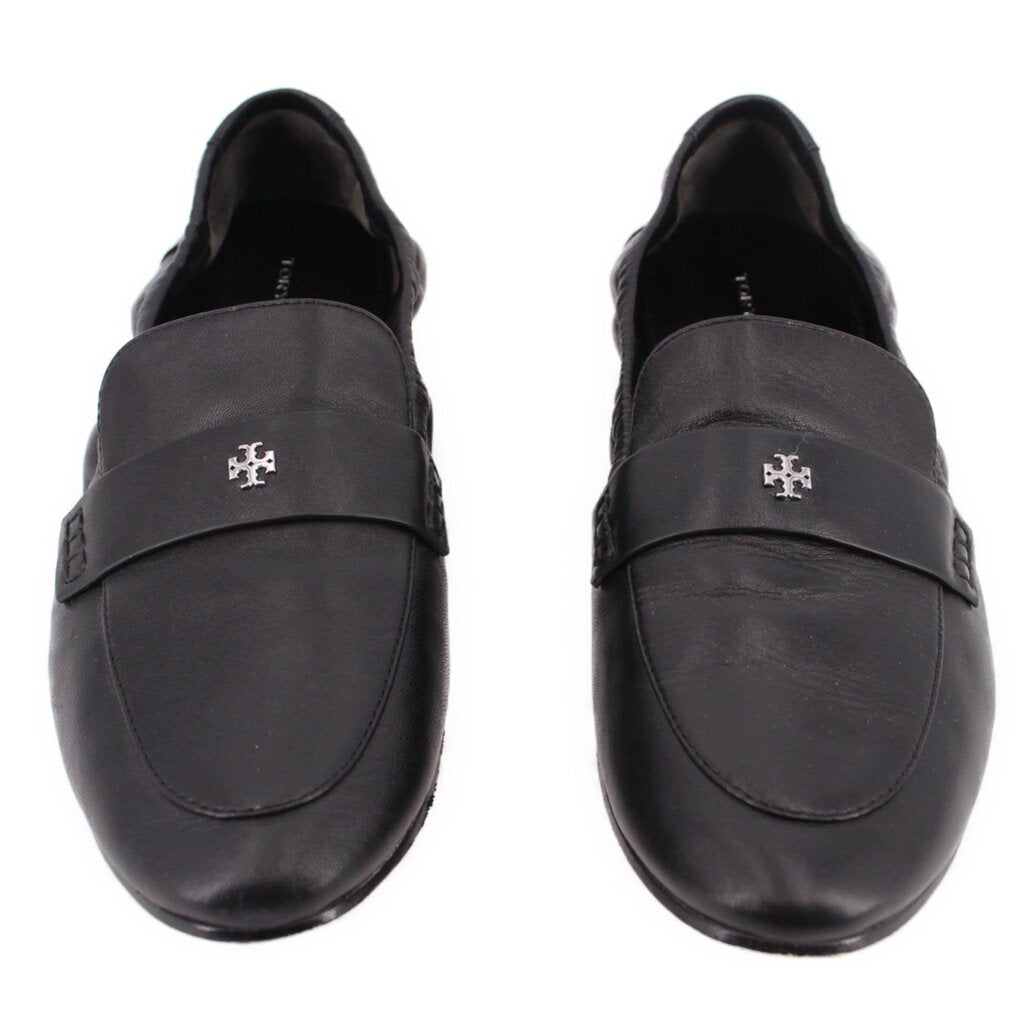 Black leather loafers with round-toe vamp, stitched seams, and logo emblem