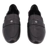 Black leather loafers with round-toe vamp, stitched seams, and logo emblem