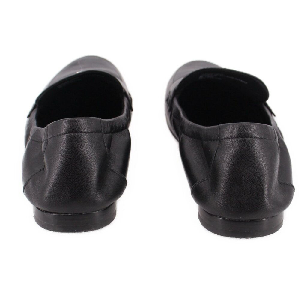 Black leather loafers with low stacked heel and stitched heel seams