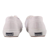 White sneakers, rear view with padded collar and heel tab branding patch