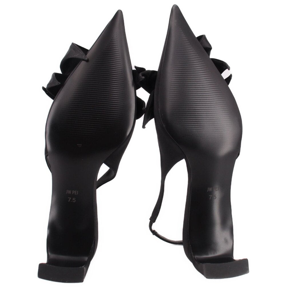 Black satin slingback heels with sculpted heel and knotted bow at toe