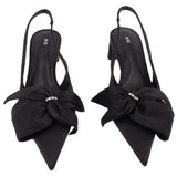 Black satin slingback heels with double bow and rhinestone buckle