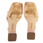 Patent heeled sandals showing insoles and rubber soles; ankle straps attached