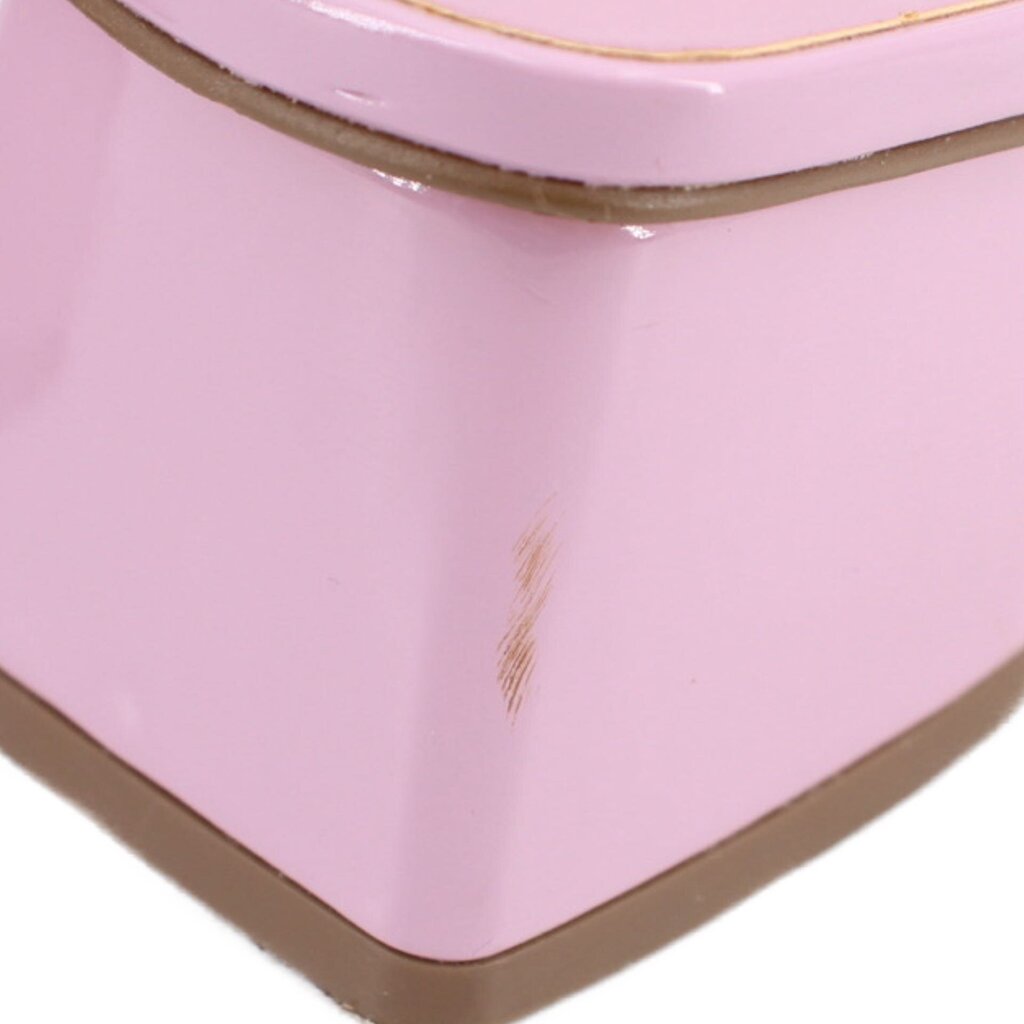 Patent upper close-up with stitched seams and glossy light purple finish