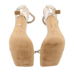 Gold metallic heeled sandals, back view with block heel and ankle strap