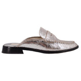 Silver metallic mule loafers, side view with instep strap and black outsole heel