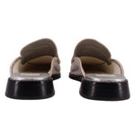 Silver metallic mule loafers, back and outsole view with rounded heel and black base