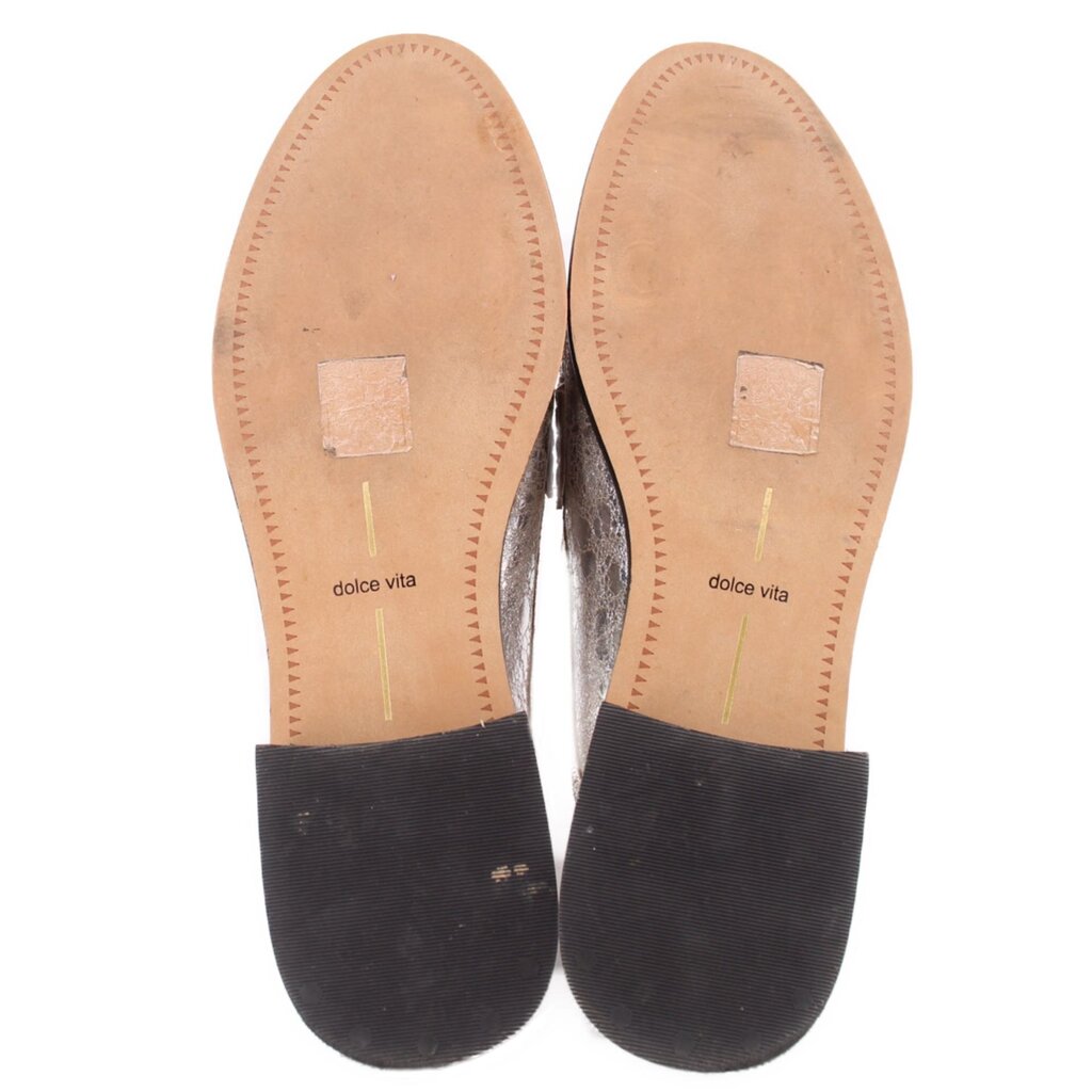 Silver metallic mule loafers inside view with beige insoles labeled dolce vita