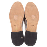 Silver metallic mule loafers inside view with beige insoles labeled dolce vita