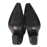 Black cowboy boots heel view with branded insole and side zipper