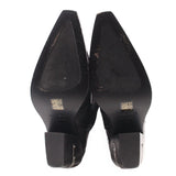 Black cowboy boots heel view with branded insole and side zipper