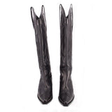Pair of black cowboy boots with pointed toe, tall shaft, decorative stitching