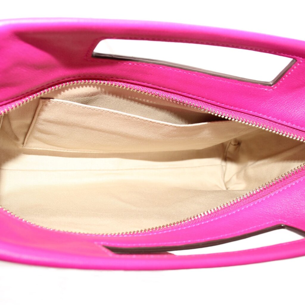 Magenta Coach clutch interior with beige lining and zip-top closure