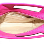 Magenta Coach clutch interior with beige lining and zip-top closure