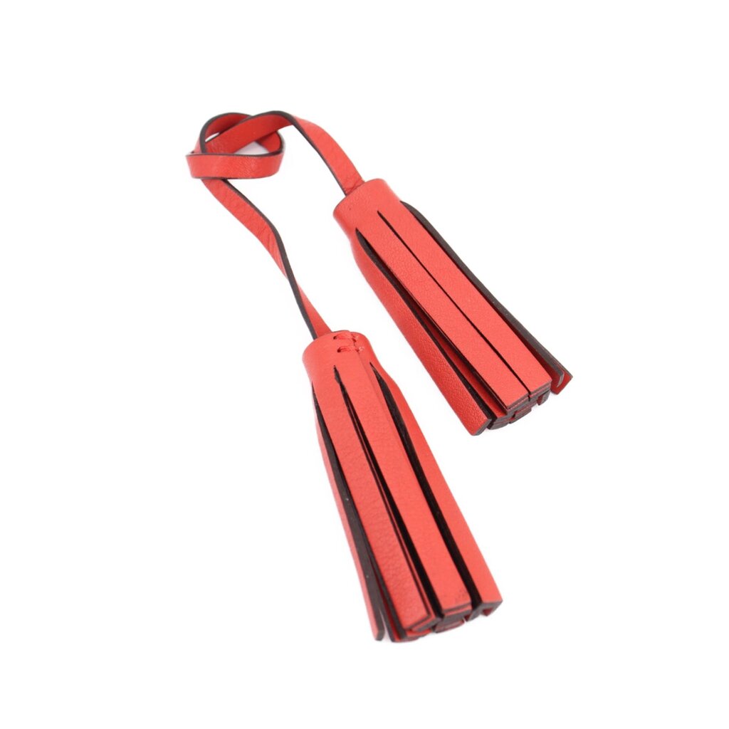 COACH red leather tassel accessory with striped fringe and loop strap