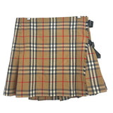 Burberry plaid skirt in tan with red and dark lines; side buckles, layered hem