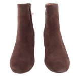 Pair of brown suede ankle booties, side view
