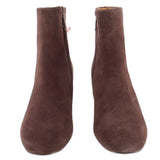 Pair of brown suede ankle booties, side view