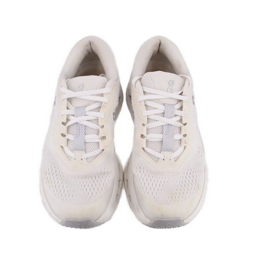 Pair of white lace-up ON Cloudrunner 3 sneakers with breathable mesh panels