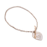 Tiffany & Co. heart charm bracelet with rose-gold arrow detail and engraved 925 tag